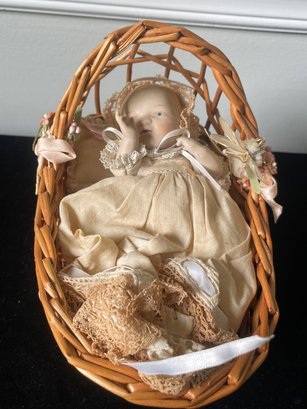 Porcelain Doll In Basket