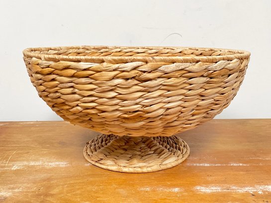 A Vintage Footed Fruit Basket In Woven Fiber