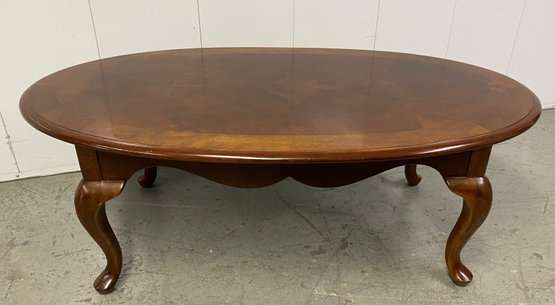 A Banded Parquetry Mohagany Color Oval Cocktailtable.