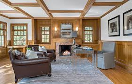 A Gorgeous Wood Paneled Den With Faux Painted Beams