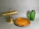 Green Water Bottle, Bankers Lamp And Wooden Plate