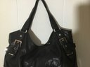 A50. Michael Kors Black Leather 6 Silver Buckle Handbag.