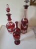 Four Pieces Of Bohemian Cranberry Etched Glass