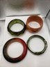 Four Unique Bangle Bracelets - One Jade, One Wood, And Two Lucite