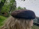 Black Velvet Fascinator Hat Paired With Brown Fur Hat With Bow From Saks Fifth Avenue