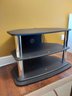 TIERED BLACK TV ENTERTAINMENT STAND WITH CHROME STYLE ACCENTS