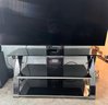 Metal And Glass TV Stand With Three Graduating Shelves