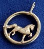 Equestrian Theme Gold Tone Trotting Horse In A Circular Pendant