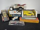 FIVE TOY TRUCKS WITH BOXES