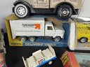 FIVE TOY TRUCKS WITH BOXES