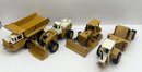 Lot Of 4 Ertl International Harvester Models - Tractor, Bulldozer, Scraper, And Dumptruck