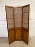 A Vintage Three Panel Wooden Screen With Gorgeous Woven Detail