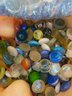Container Of Glass Pieces And Marbles