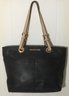 A41. Michael Kors Black Leather, Cream Leather Strap Tote Handbag.