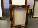 A Group Of Four Picture Frames.