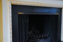 An Ornate Decorative Fireplace Surround And Mantel
