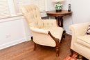 Upholstered Tufted Carved Mahogany Club Chair With Front Casters