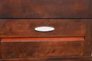 Nine Drawer Wood Dresser With Matching Oval Wall Mirror