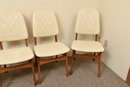Set Of Four Mid-Century Teak And Faux Leather Chairs