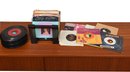 Collection Of Assorted 45 Vinyl Records With Stand