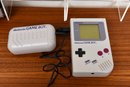 Vintage Nintendo Game Boy System With Five Games In Carrying Pouch