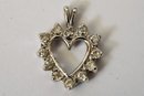 14k White Gold And Diamond Heart Pendant And 18k Yellow Gold Ruby Heart Pendant