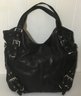 A50. Michael Kors Black Leather 6 Silver Buckle Handbag.