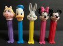PEZ Lot: 9 NIP Characters: Sponge Bob, Santas, Lucy,Snowman 4 Standing Figures Made In Hungary