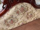 An Ornately Carved Mahogany Victorian Settee