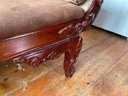 An Ornately Carved Mahogany Victorian Settee