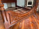 A Mahogany Queen Bedstead With Ornate Carvings By Coaster Furniture