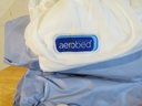 Aerobed Electric Air Pump Blow Up Mattress For Those Extra Guests In Green Gunny Sack