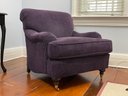 An Attractive Arm Chair In Purple Corduroy By The Stanford Chair Company