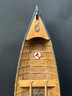 A Vintage Model Rowboat In Wood