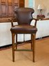 A Pair Of Bar Stools In Chestnut Leather With Nailhead Trim By Hickory Chair
