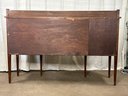 A Beautiful Hepplewhite Federal Bow-Front Sideboard
