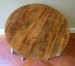 A Round Accent Table With Wood Top