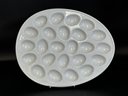 A Classic Deviled Egg Platter In White Ceramic