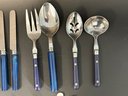 A Beautiful Set Of Stainless Flatware With Blue Marbled Handles