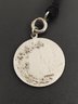 ANTIQUE STERLING SILVER RELIGIOUS MEDAL ON BLACK RIBBON