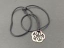 STERLING SILVER CELTIC STYLE FLOWER PENDANT ON SILK NECKLACE