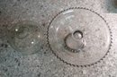 A Pairing Of 2 Glass Cake Stands With Domes
