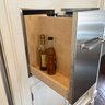 A Stainless Steel Clad Slide Out Spice Cabinet