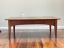 A Grained Maple Coffee Table By Ethan Allen