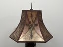 A Vintage Bronze Standing Lamp With Ornate Shade