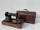 A Vintage Singer Sewing Machine In Case