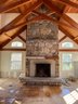 A Massive Granite Hearth And Fireplace Surround Including Wood Mantel