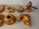 Assortment Of Copper And Aluminum Molds And Copper Teapot