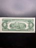 1963-A Red Seal $2 Bill AU CONDITION