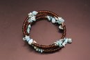 Turquoise And Amber Colored Bead Coil Bracelet